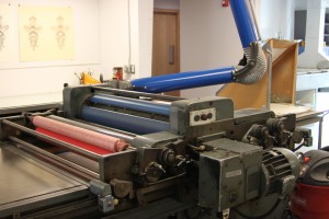 This printing press is stored in the lower level of UNM's own Tamarind Institute. No longer in use, this press is simply for show.