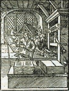 An early illustration of printers creating pamphlets from a press.