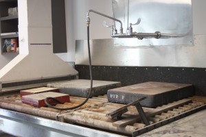 A wash station where the slabs of stone are washed an sanded down for further use.